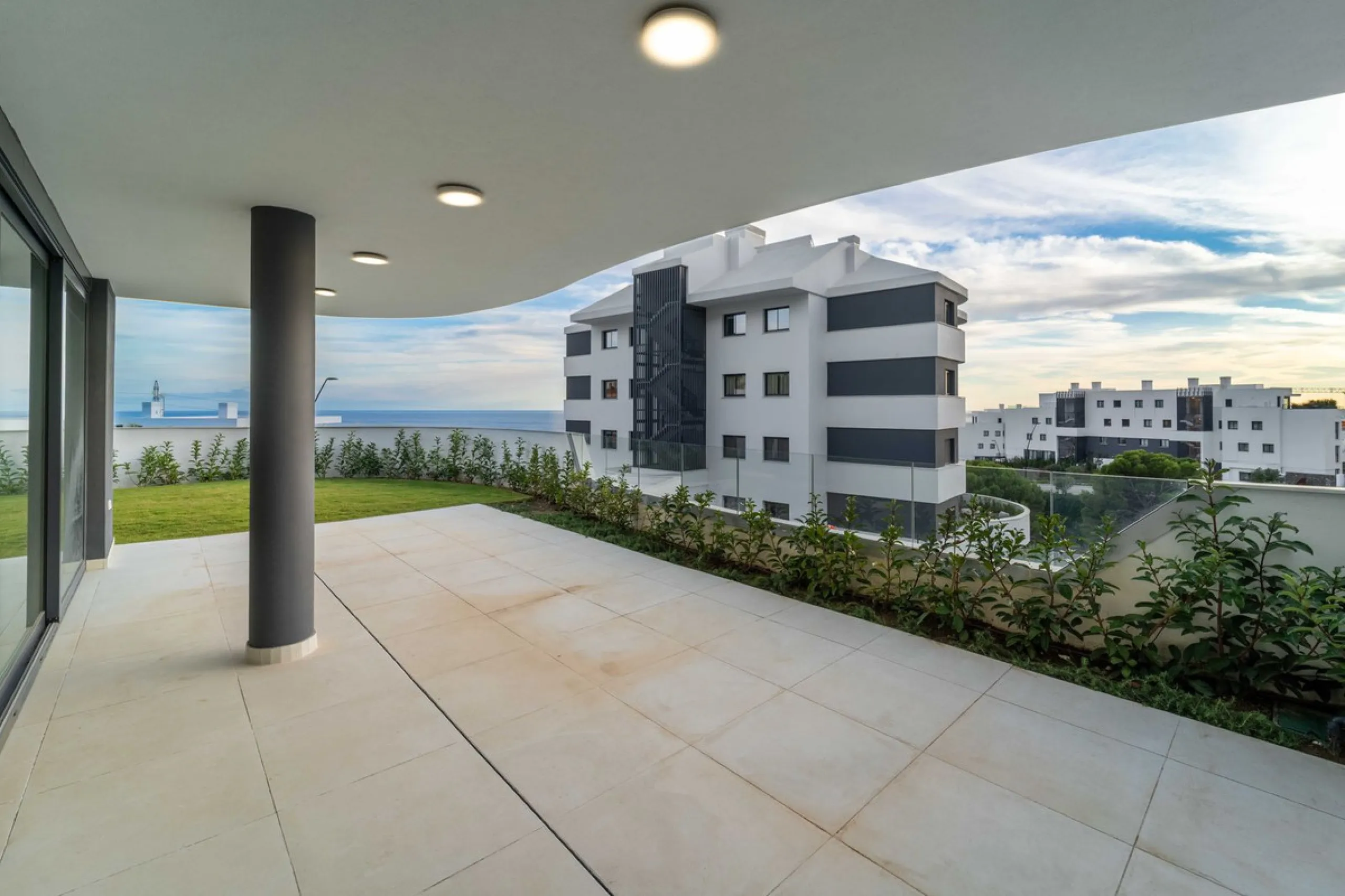 Welcome to a beautifully positioned southwest-facing garden apartment in the heart of Higuerón — a home that offers both privacy and extraordinary views. Located on the eastern corner of the building, this residence is one of only two ground-floor apartme