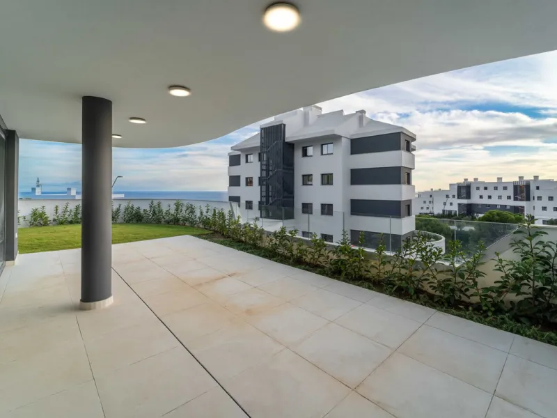 Welcome to a beautifully positioned southwest-facing garden apartment in the heart of Higuerón — a home that offers both privacy and extraordinary views. Located on the eastern corner of the building, this residence is one of only two ground-floor apartme