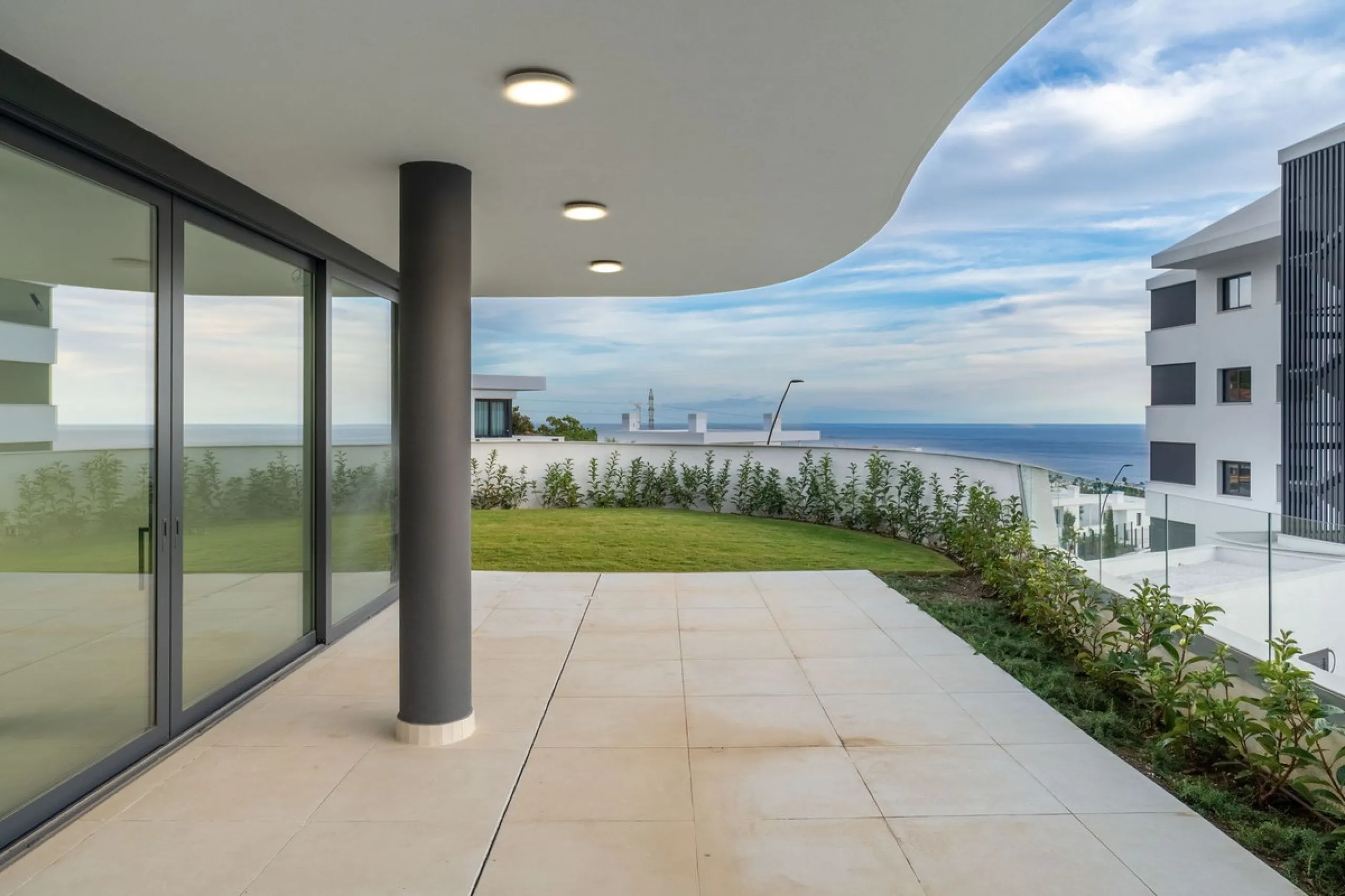 Welcome to a beautifully positioned southwest-facing garden apartment in the heart of Higuerón — a home that offers both privacy and extraordinary views. Located on the eastern corner of the building, this residence is one of only two ground-floor apartme