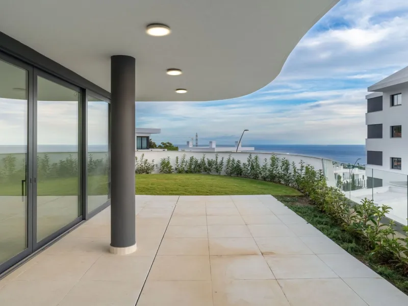 Welcome to a beautifully positioned southwest-facing garden apartment in the heart of Higuerón — a home that offers both privacy and extraordinary views. Located on the eastern corner of the building, this residence is one of only two ground-floor apartme