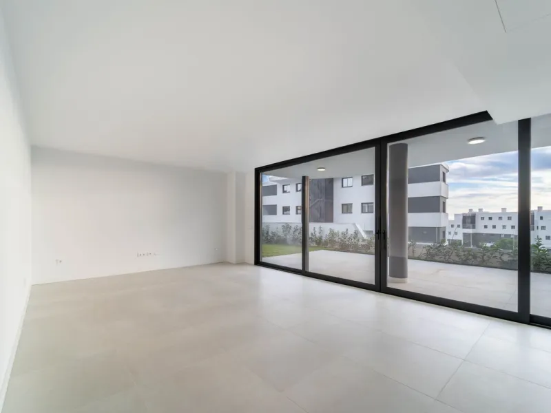Welcome to a beautifully positioned southwest-facing garden apartment in the heart of Higuerón — a home that offers both privacy and extraordinary views. Located on the eastern corner of the building, this residence is one of only two ground-floor apartme