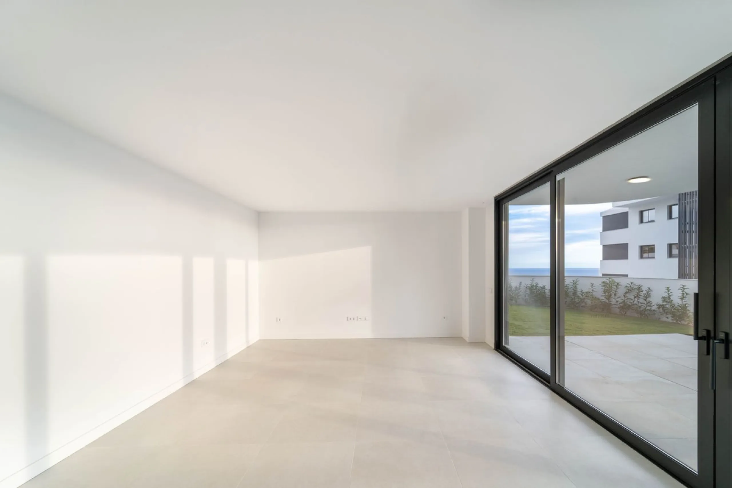 Welcome to a beautifully positioned southwest-facing garden apartment in the heart of Higuerón — a home that offers both privacy and extraordinary views. Located on the eastern corner of the building, this residence is one of only two ground-floor apartme