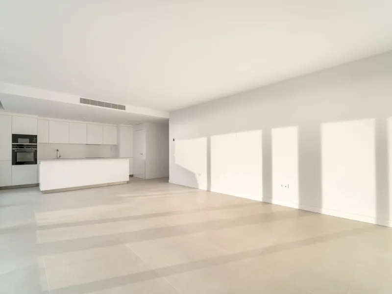 Welcome to a beautifully positioned southwest-facing garden apartment in the heart of Higuerón — a home that offers both privacy and extraordinary views. Located on the eastern corner of the building, this residence is one of only two ground-floor apartme