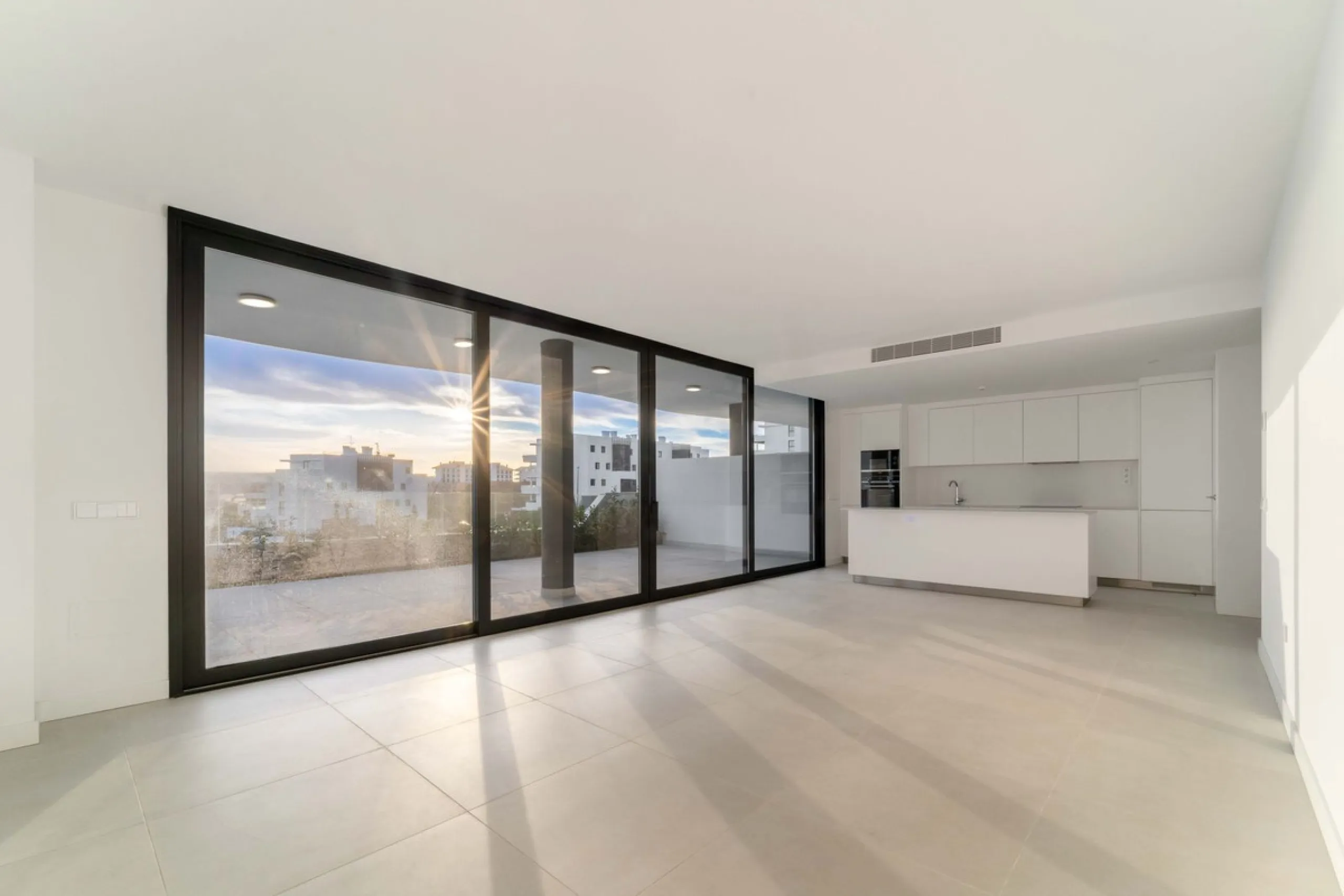 Welcome to a beautifully positioned southwest-facing garden apartment in the heart of Higuerón — a home that offers both privacy and extraordinary views. Located on the eastern corner of the building, this residence is one of only two ground-floor apartme