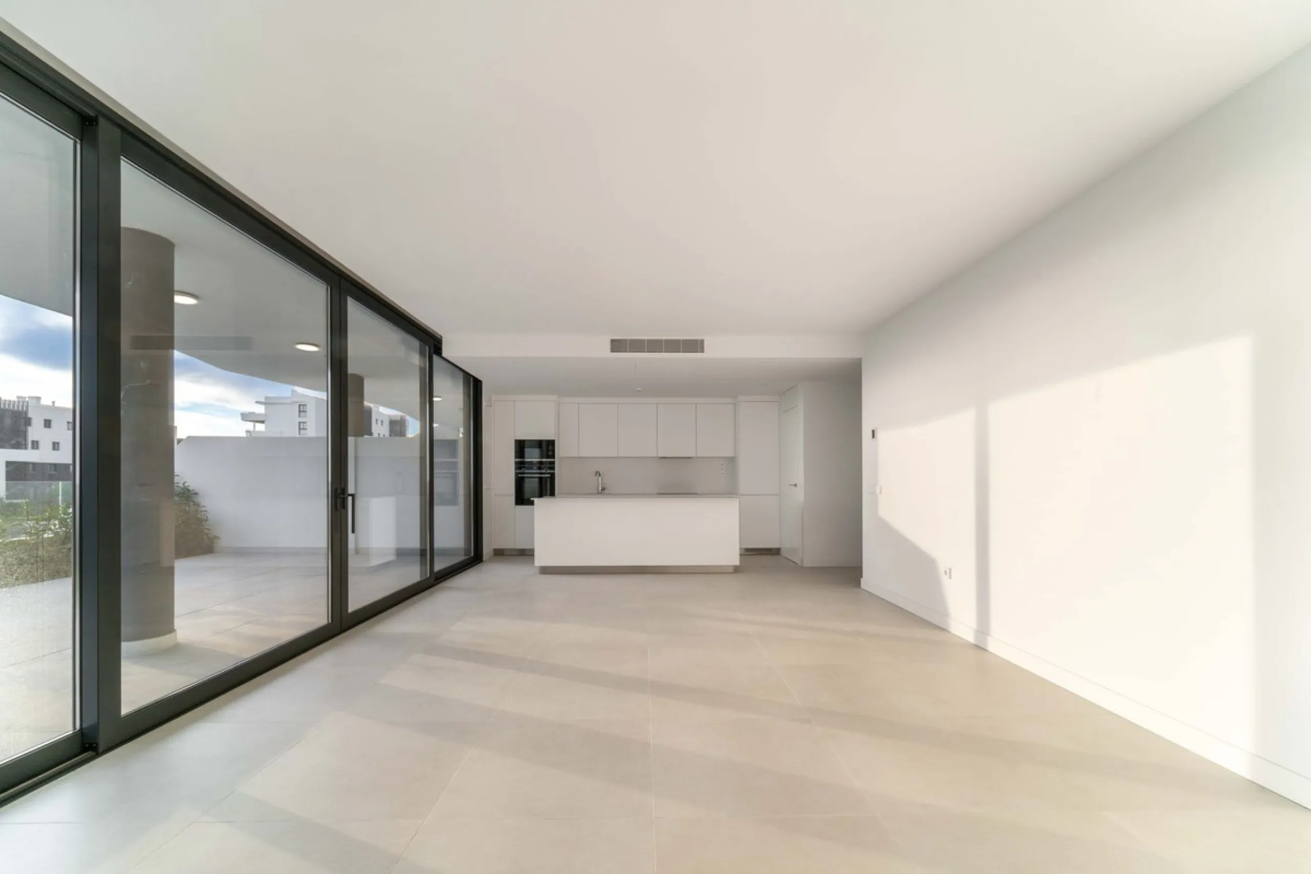 Welcome to a beautifully positioned southwest-facing garden apartment in the heart of Higuerón — a home that offers both privacy and extraordinary views. Located on the eastern corner of the building, this residence is one of only two ground-floor apartme