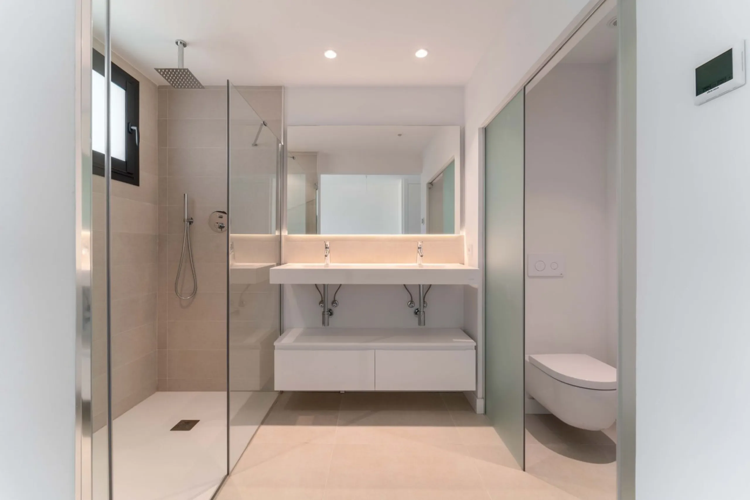 Welcome to a beautifully positioned southwest-facing garden apartment in the heart of Higuerón — a home that offers both privacy and extraordinary views. Located on the eastern corner of the building, this residence is one of only two ground-floor apartme
