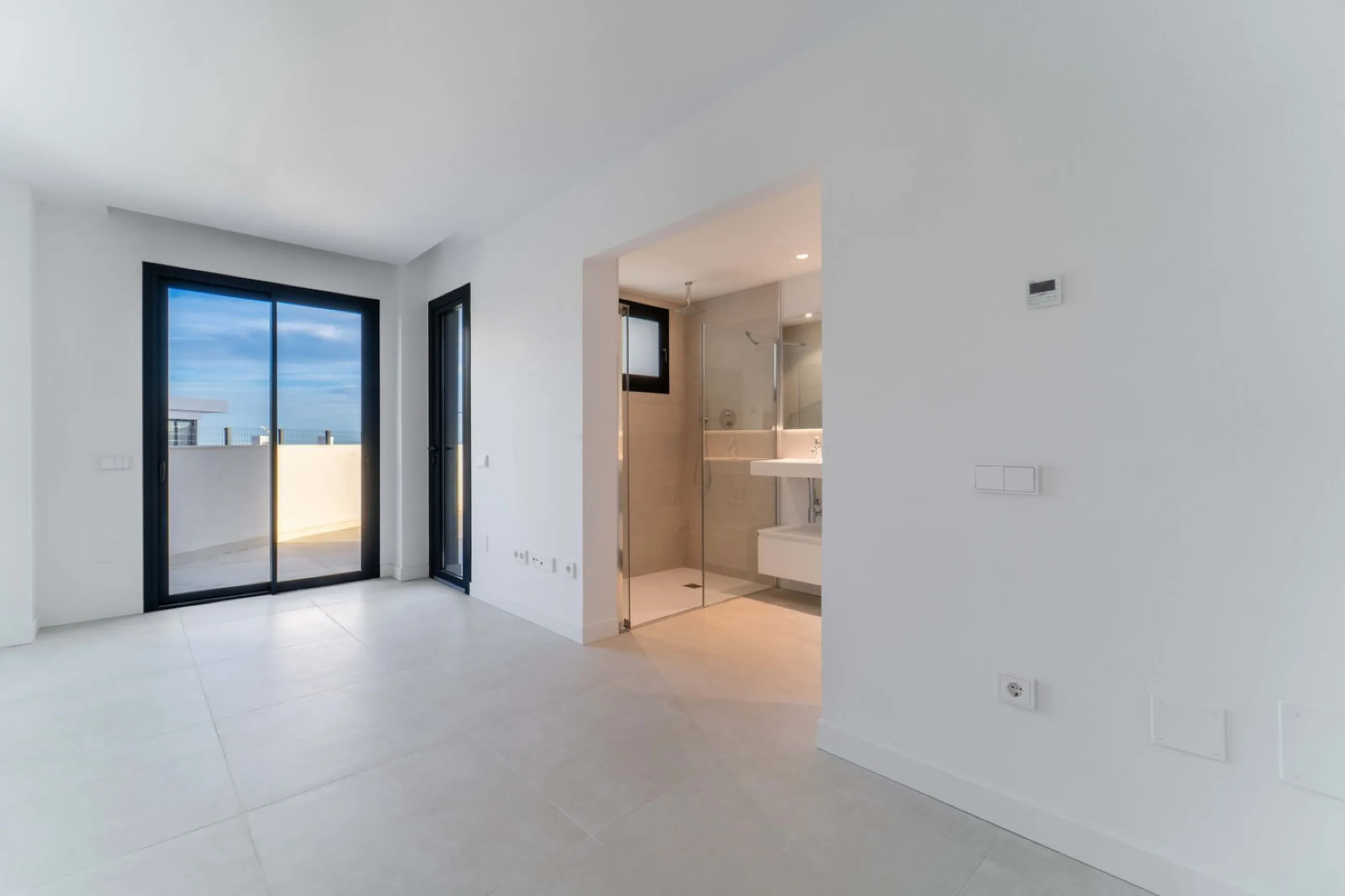 Welcome to a beautifully positioned southwest-facing garden apartment in the heart of Higuerón — a home that offers both privacy and extraordinary views. Located on the eastern corner of the building, this residence is one of only two ground-floor apartme