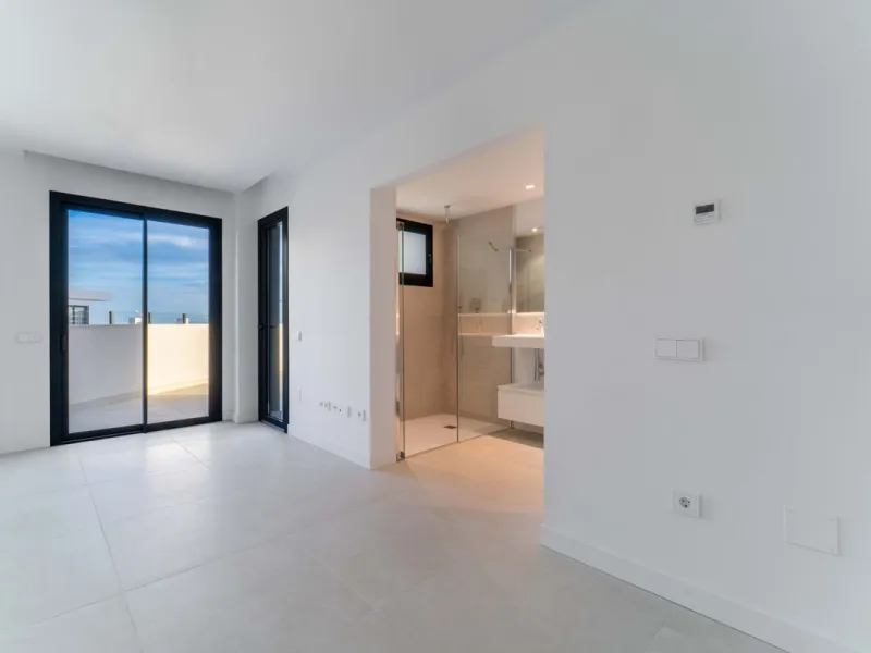 Welcome to a beautifully positioned southwest-facing garden apartment in the heart of Higuerón — a home that offers both privacy and extraordinary views. Located on the eastern corner of the building, this residence is one of only two ground-floor apartme