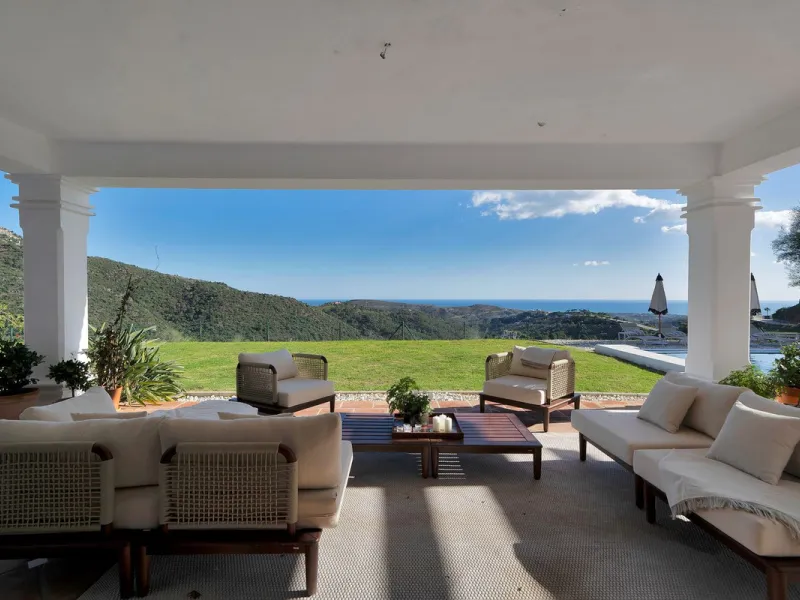 Set within the exclusive gated community of Monte Mayor, this exceptional south-facing detached villa offers breathtaking panoramic sea views from a generous 4,075m² plot. This villa stands out from most due to the elegant combination of Andalucian archit