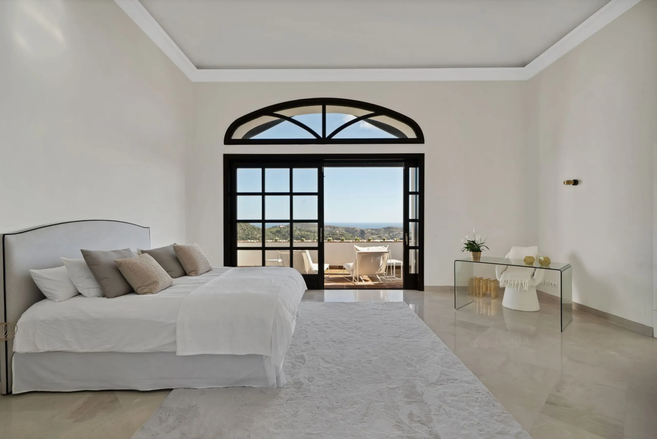 Set within the exclusive gated community of Monte Mayor, this exceptional south-facing detached villa offers breathtaking panoramic sea views from a generous 4,075m² plot. This villa stands out from most due to the elegant combination of Andalucian archit