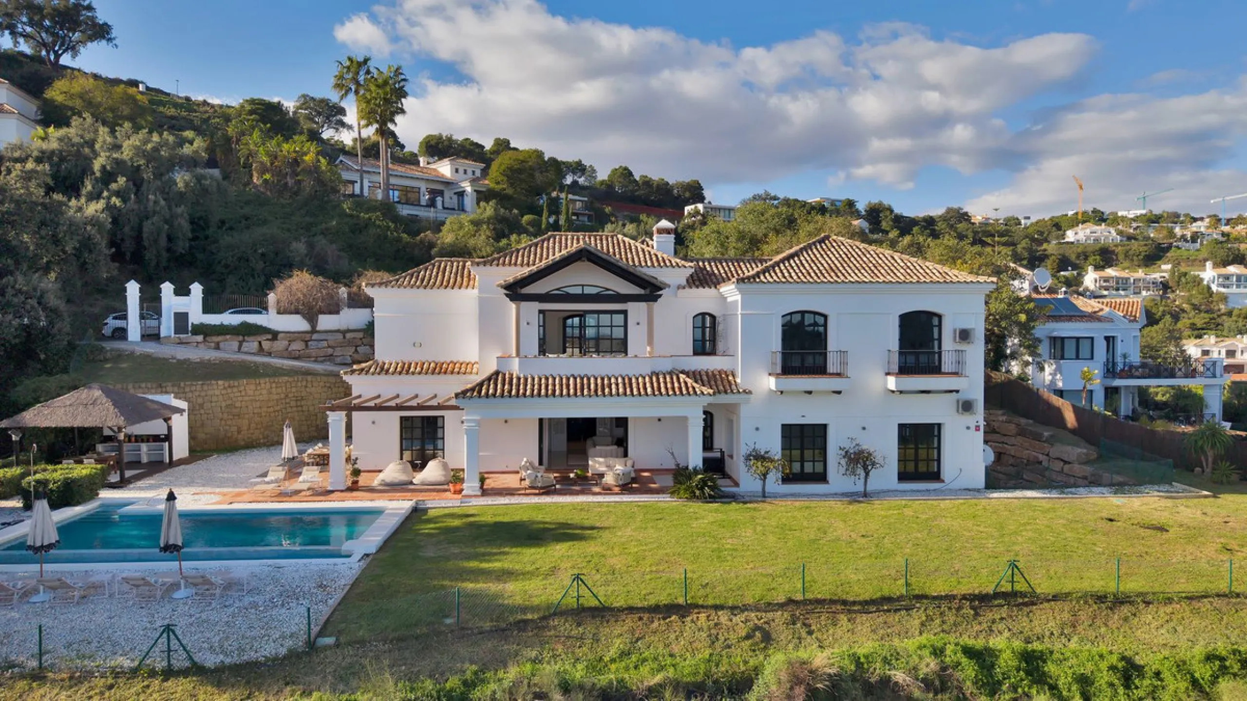 Set within the exclusive gated community of Monte Mayor, this exceptional south-facing detached villa offers breathtaking panoramic sea views from a generous 4,075m² plot. This villa stands out from most due to the elegant combination of Andalucian archit