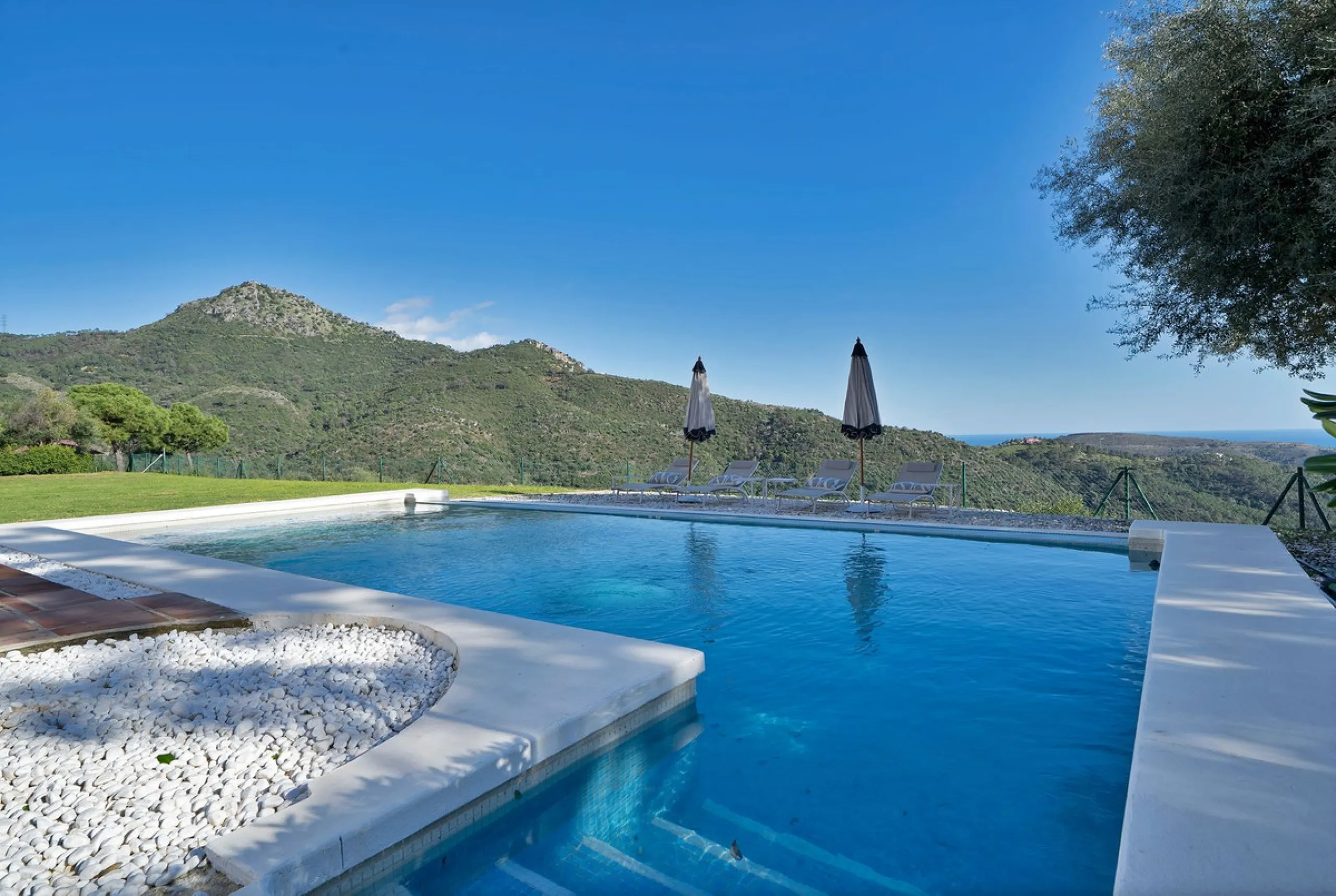 Set within the exclusive gated community of Monte Mayor, this exceptional south-facing detached villa offers breathtaking panoramic sea views from a generous 4,075m² plot. This villa stands out from most due to the elegant combination of Andalucian archit