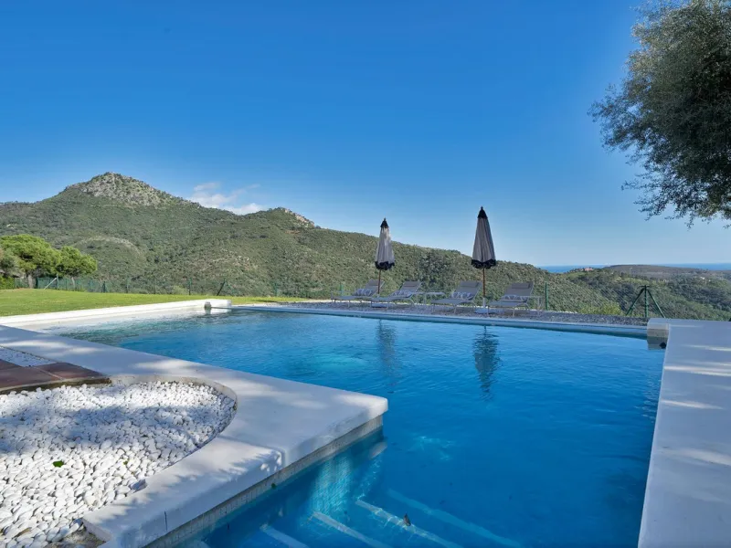 Set within the exclusive gated community of Monte Mayor, this exceptional south-facing detached villa offers breathtaking panoramic sea views from a generous 4,075m² plot. This villa stands out from most due to the elegant combination of Andalucian archit