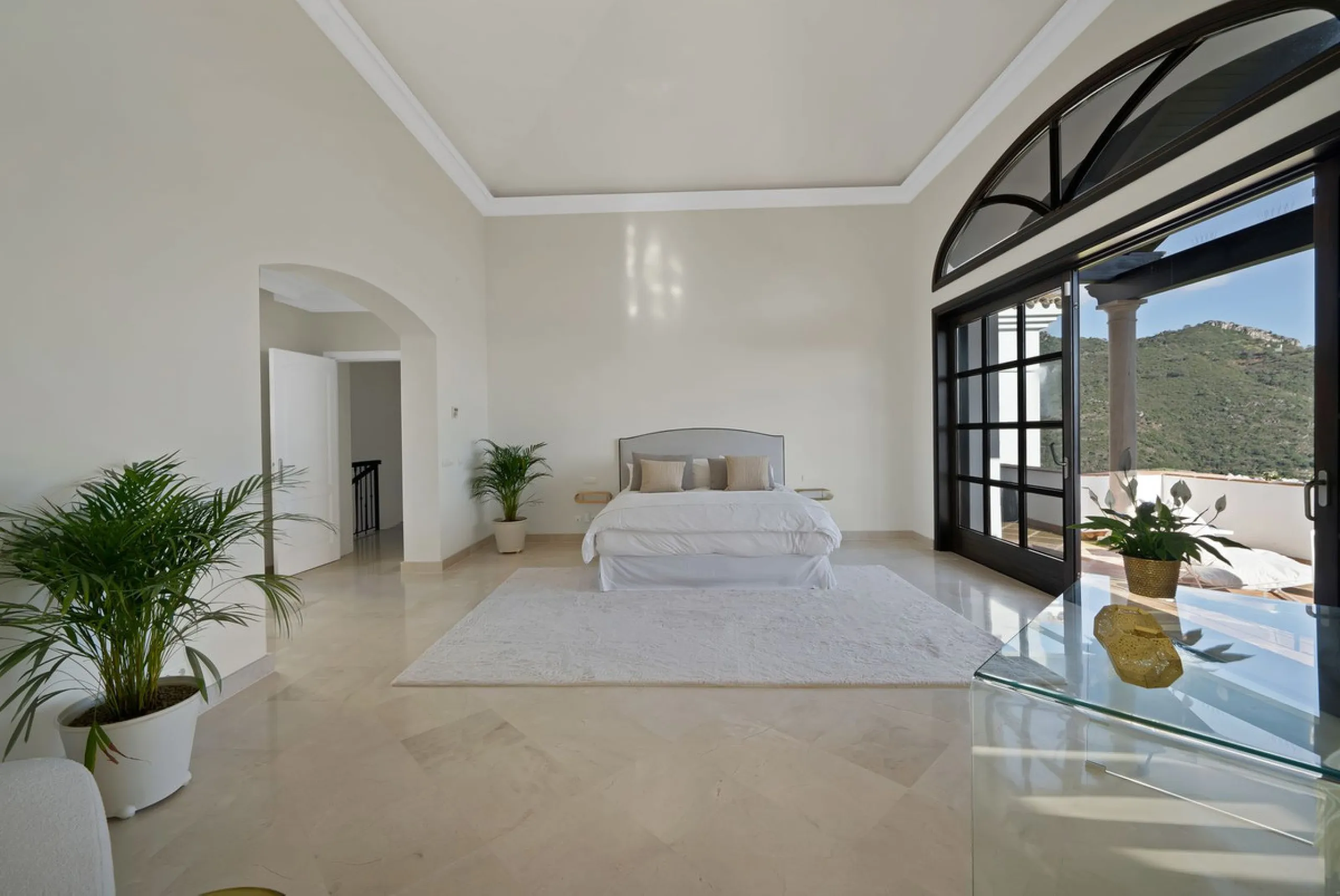 Set within the exclusive gated community of Monte Mayor, this exceptional south-facing detached villa offers breathtaking panoramic sea views from a generous 4,075m² plot. This villa stands out from most due to the elegant combination of Andalucian archit