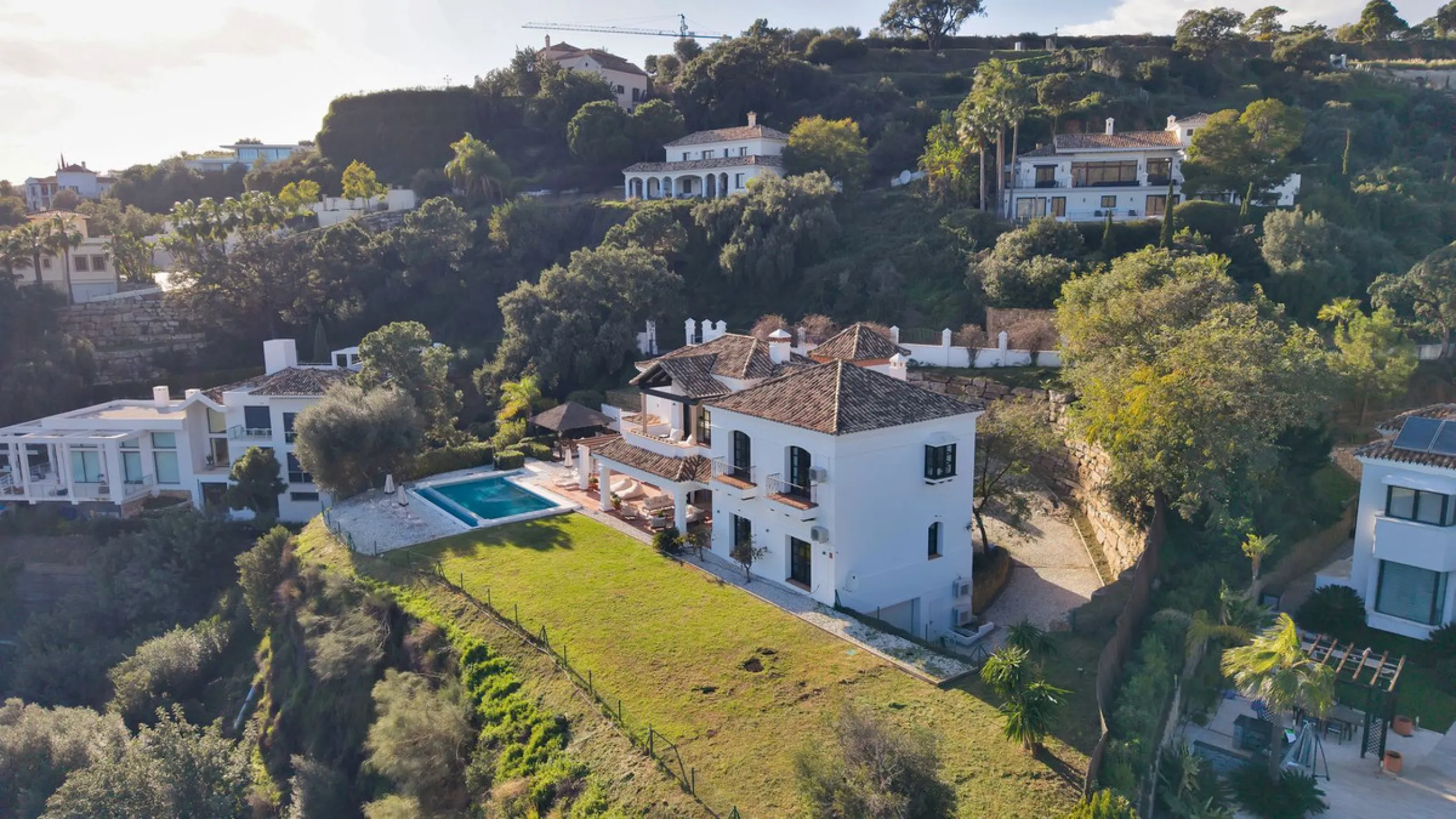 Set within the exclusive gated community of Monte Mayor, this exceptional south-facing detached villa offers breathtaking panoramic sea views from a generous 4,075m² plot. This villa stands out from most due to the elegant combination of Andalucian archit