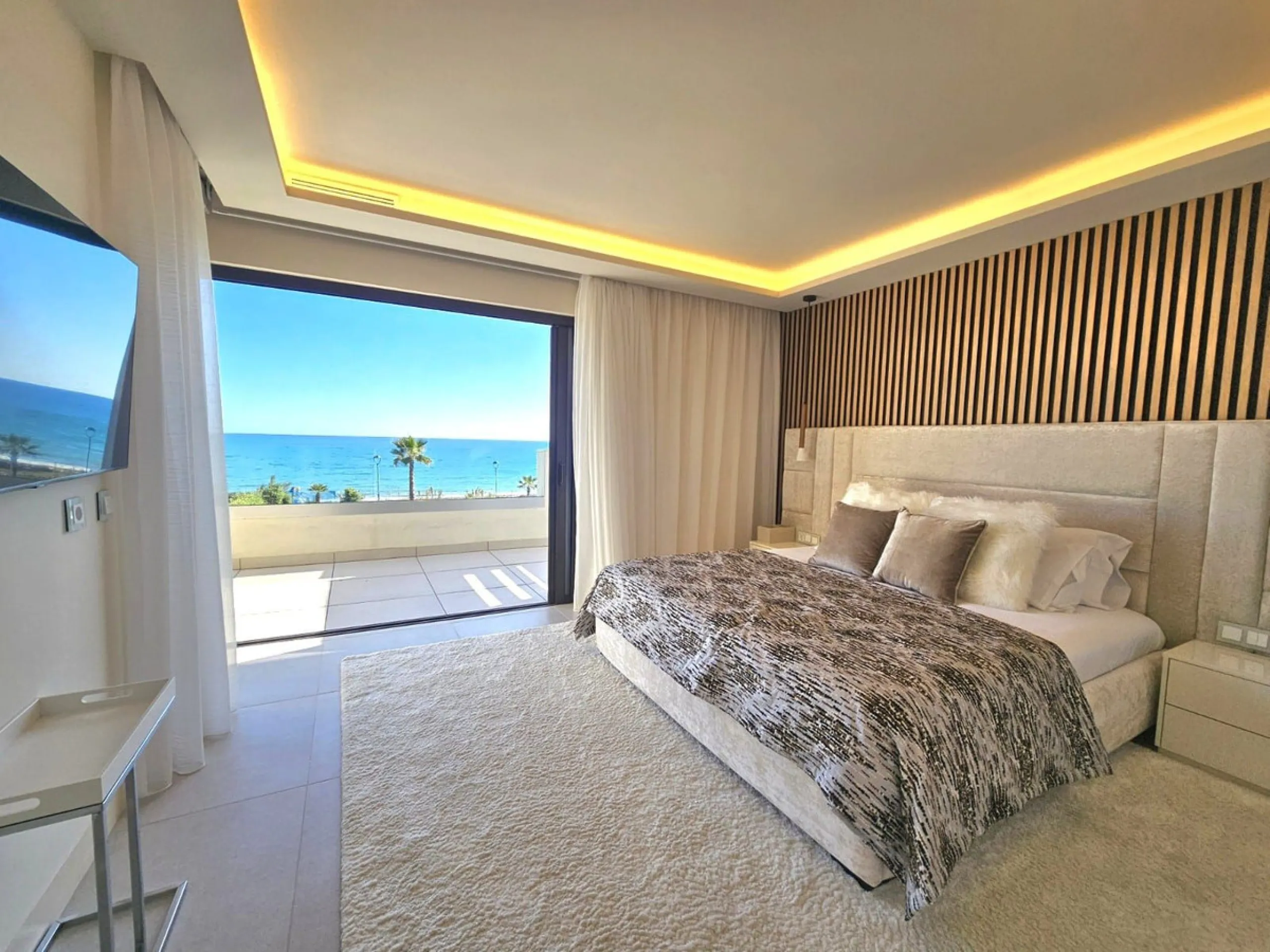 This beautiful house is located in an enviable beachfront position within the prestigious Velaya development on the New Golden Mile, offering breathtaking sea views and direct access to the beach.