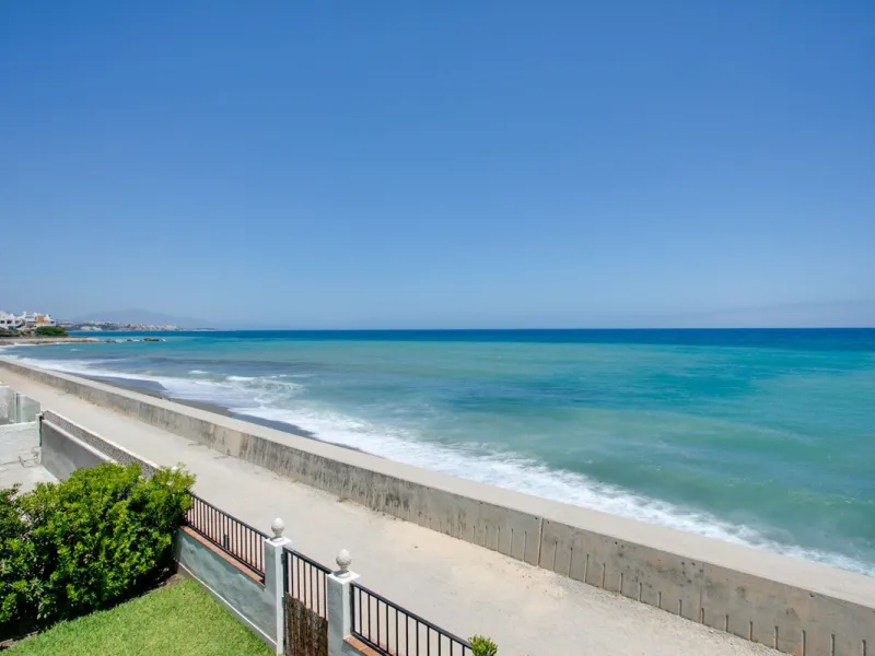 A beautifully renovated beachfront villa with perfect sea views. The house has been tastefully modernised to offer a large open plan living room with fully fitted modern kitchen, on the lower level is also one of the 3 bedrooms with bathroom.