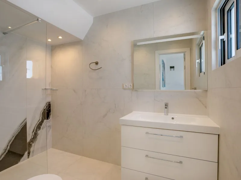 A beautifully renovated beachfront villa with perfect sea views. The house has been tastefully modernised to offer a large open plan living room with fully fitted modern kitchen, on the lower level is also one of the 3 bedrooms with bathroom.