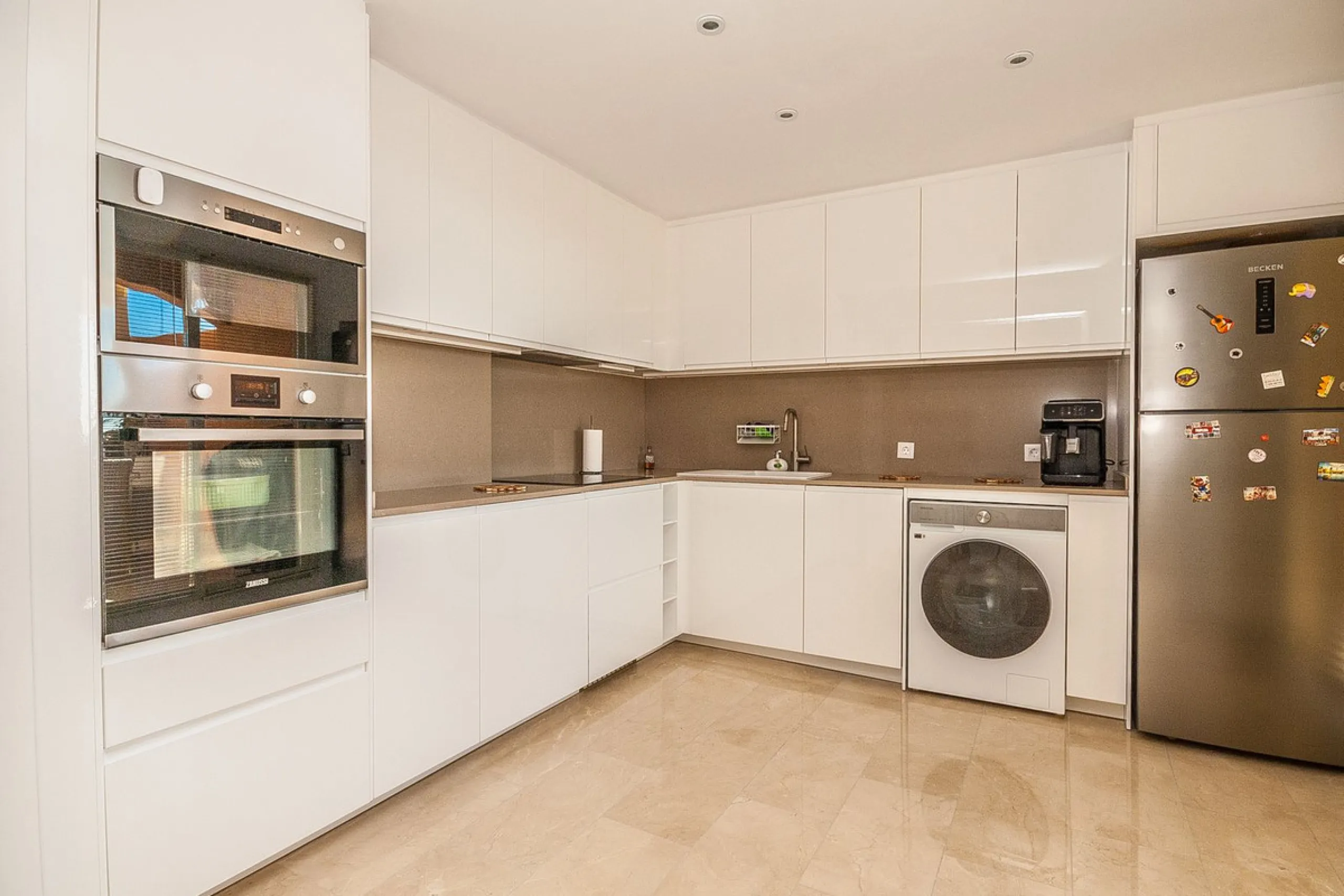 Discover your dream retreat in this stunning two-bedroom penthouse, where breathtaking views await you at every turn. Featuring a modernized kitchen and bathrooms, this residence combines style and functionality. Enjoy the convenience of underground parki