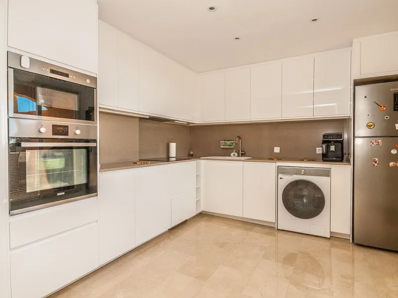 Discover your dream retreat in this stunning two-bedroom penthouse, where breathtaking views await you at every turn. Featuring a modernized kitchen and bathrooms, this residence combines style and functionality. Enjoy the convenience of underground parki