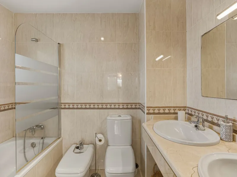 Situated in the sought-after area of Riviera del Sol, Mijas, this well-presented three-bedroom, two-bathroom first-floor apartment offers comfortable coastal living within walking distance of local amenities and the beach.
