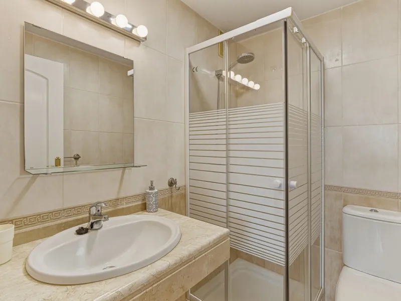 Situated in the sought-after area of Riviera del Sol, Mijas, this well-presented three-bedroom, two-bathroom first-floor apartment offers comfortable coastal living within walking distance of local amenities and the beach.