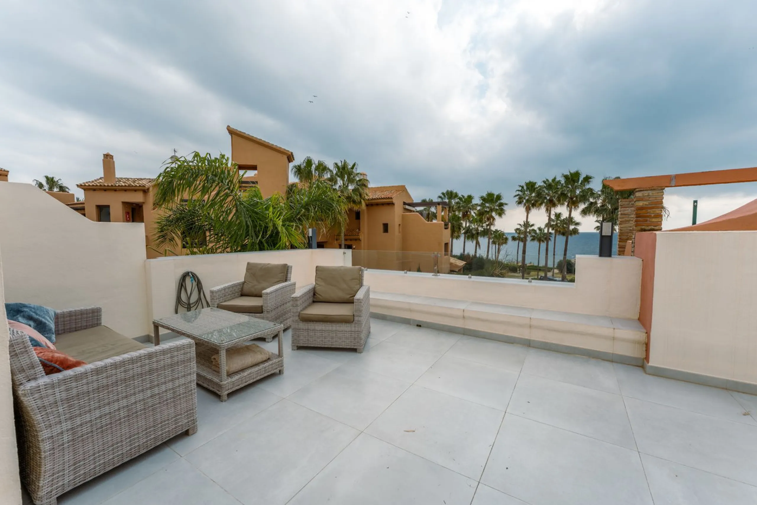This is true frontline beach living in Garden Beach, Estepona — a first-line sea complex where the Mediterranean becomes part of your everyday life. Positioned directly on the coast, the property enjoys open sea views, protected coastal frontage, and the 