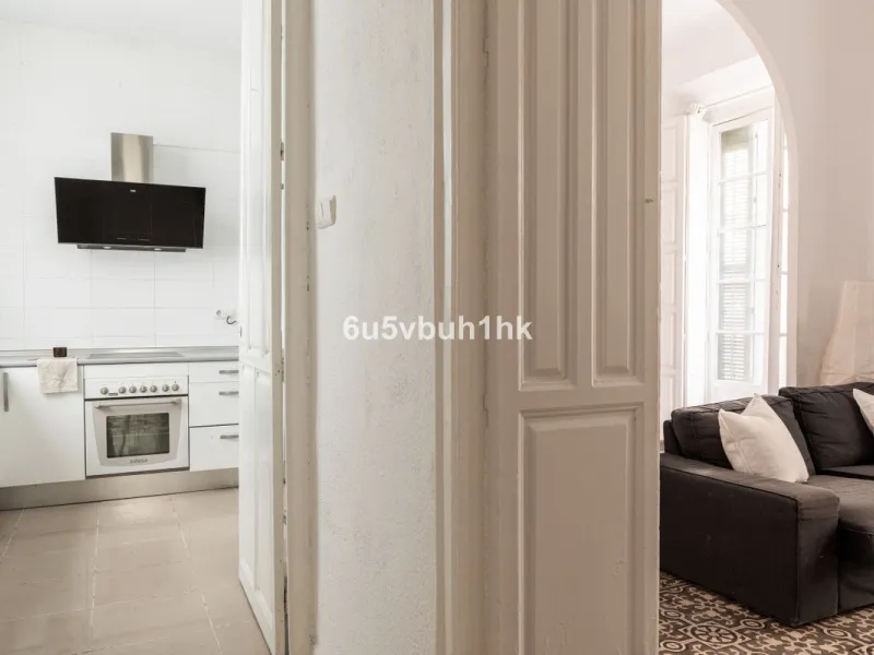 Located on Calle Císter, one of Málaga's most prestigious and sought-after streets — directly beside the iconic Cathedral — this spacious apartment offers a rare opportunity to acquire a property of character in the very heart of the historic centre.