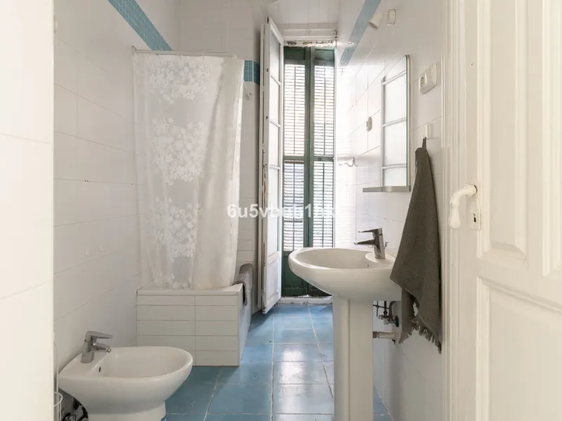 Located on Calle Císter, one of Málaga's most prestigious and sought-after streets — directly beside the iconic Cathedral — this spacious apartment offers a rare opportunity to acquire a property of character in the very heart of the historic centre.