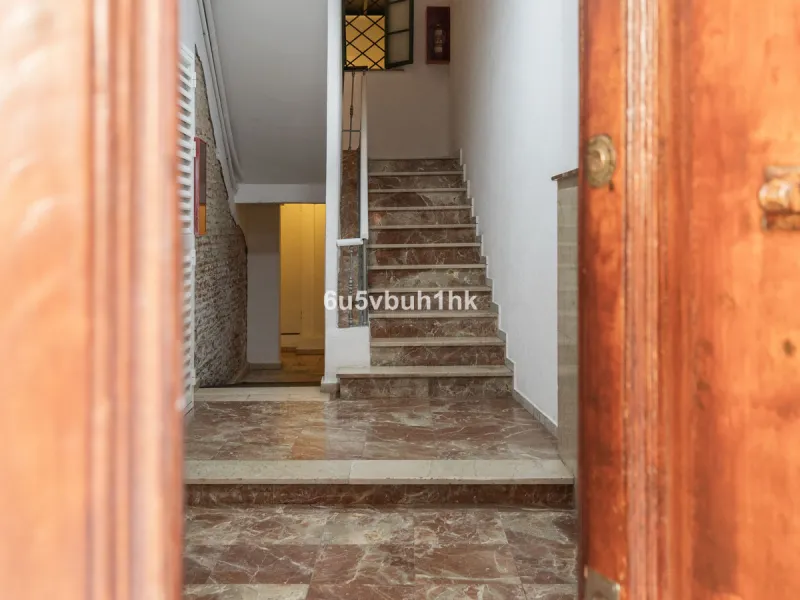 Located on Calle Císter, one of Málaga's most prestigious and sought-after streets — directly beside the iconic Cathedral — this spacious apartment offers a rare opportunity to acquire a property of character in the very heart of the historic centre.