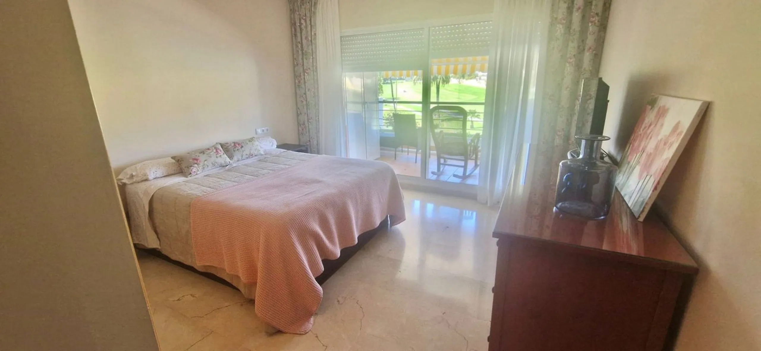 Bright apartment with golf course, garden, and pool views in a gated community!