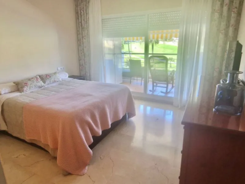 Bright apartment with golf course, garden, and pool views in a gated community!