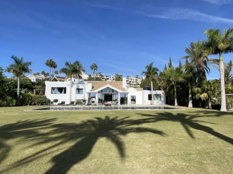 Set within an exclusive gated community in Benahavis, this exceptional luxury villa offers privacy, elegance, and breathtaking panoramic views stretching across the golf course to the Mediterranean Sea.