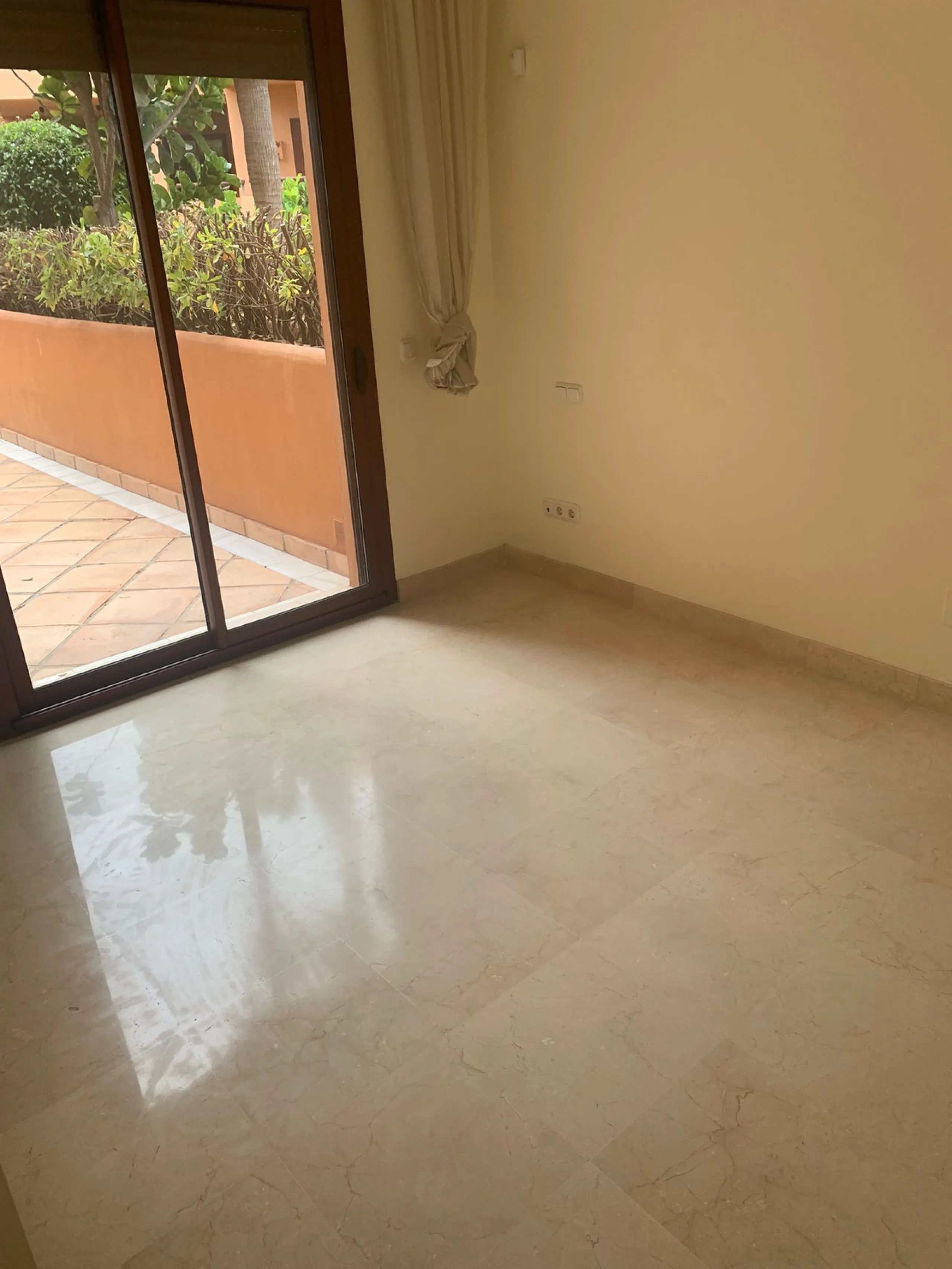 Located within the exclusive Gran Bahía Marbella development, this spacious ground-floor apartment offers refined coastal living just steps from the beach.