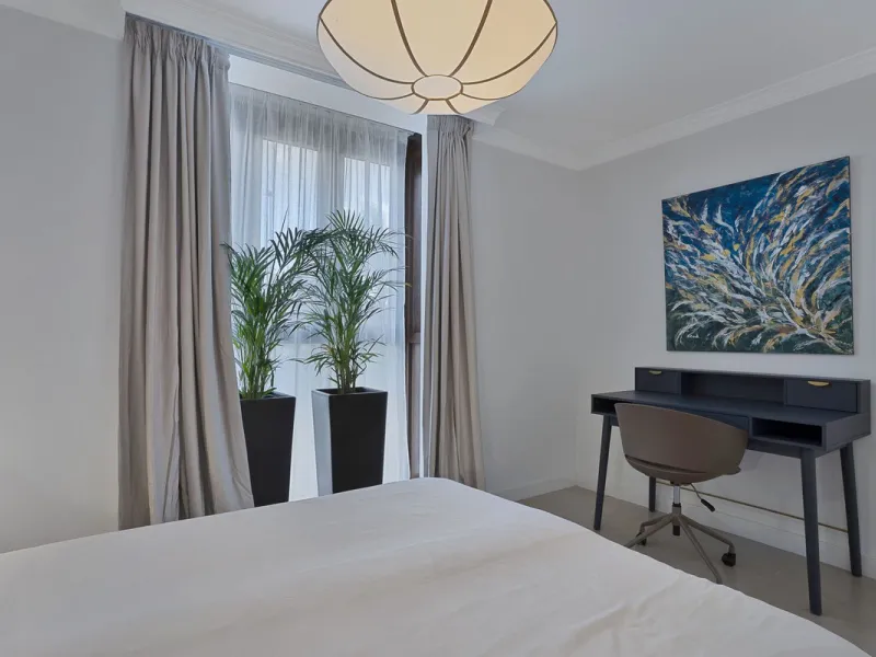 Bright and modern 2-room apartments with high ceilings, filled with sunlight and a sense of space.