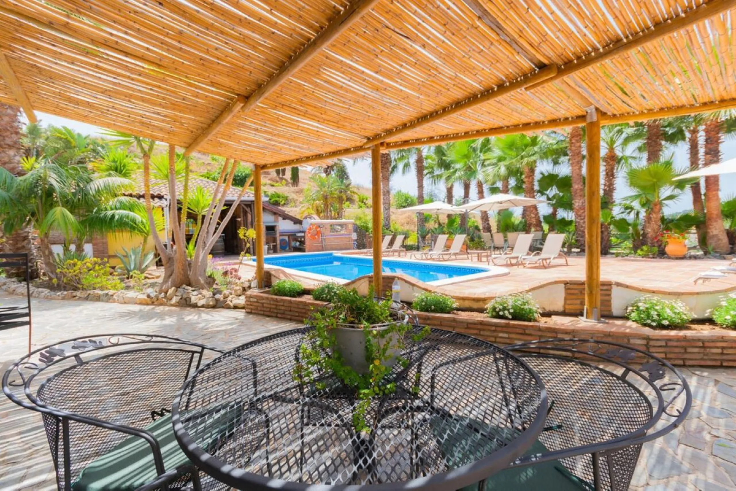 A rare opportunity to own a truly enchanting estate near the picturesque Mijas Pueblo. Set on an expansive 16,000 m² plot, this gated property offers breathtaking panoramic views surrounded by fruit trees, almond trees, and olive groves, creating a peacef