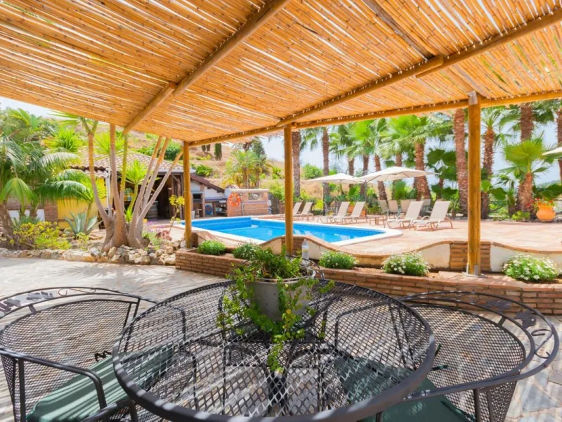A rare opportunity to own a truly enchanting estate near the picturesque Mijas Pueblo. Set on an expansive 16,000 m² plot, this gated property offers breathtaking panoramic views surrounded by fruit trees, almond trees, and olive groves, creating a peacef