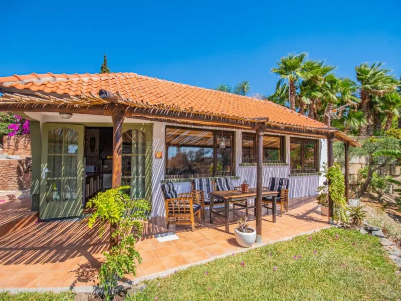 A rare opportunity to own a truly enchanting estate near the picturesque Mijas Pueblo. Set on an expansive 16,000 m² plot, this gated property offers breathtaking panoramic views surrounded by fruit trees, almond trees, and olive groves, creating a peacef