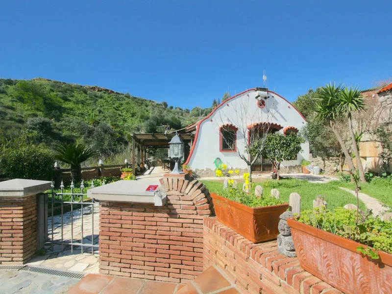 A rare opportunity to own a truly enchanting estate near the picturesque Mijas Pueblo. Set on an expansive 16,000 m² plot, this gated property offers breathtaking panoramic views surrounded by fruit trees, almond trees, and olive groves, creating a peacef