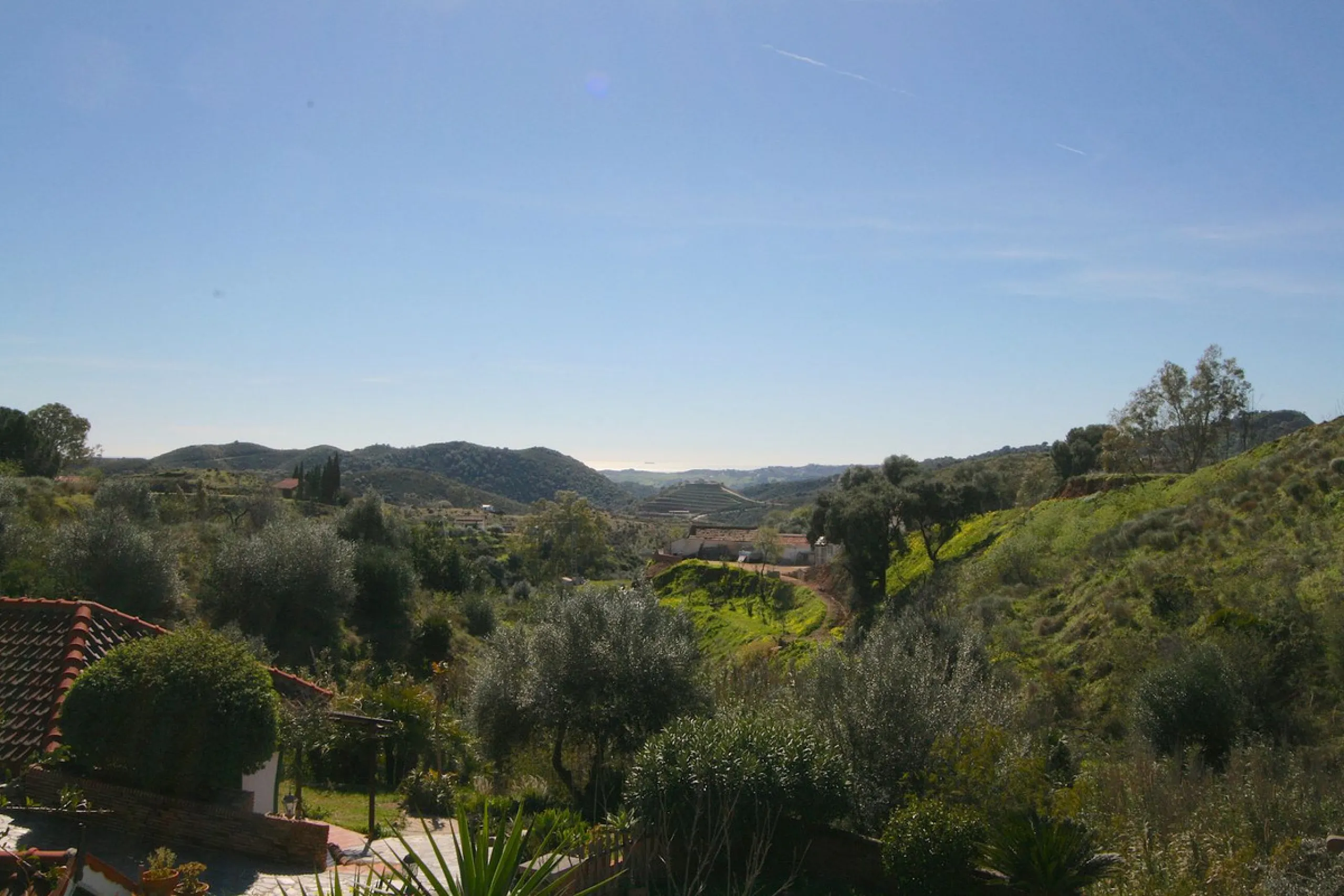 A rare opportunity to own a truly enchanting estate near the picturesque Mijas Pueblo. Set on an expansive 16,000 m² plot, this gated property offers breathtaking panoramic views surrounded by fruit trees, almond trees, and olive groves, creating a peacef