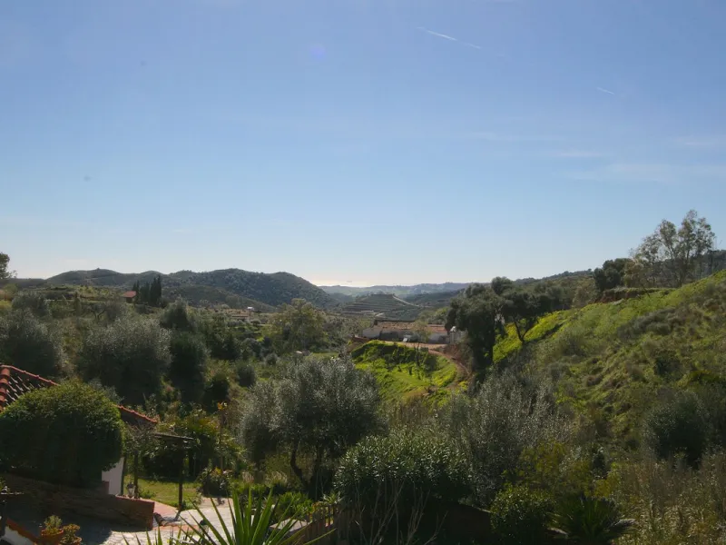 A rare opportunity to own a truly enchanting estate near the picturesque Mijas Pueblo. Set on an expansive 16,000 m² plot, this gated property offers breathtaking panoramic views surrounded by fruit trees, almond trees, and olive groves, creating a peacef