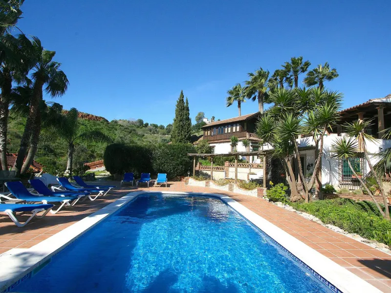 A rare opportunity to own a truly enchanting estate near the picturesque Mijas Pueblo. Set on an expansive 16,000 m² plot, this gated property offers breathtaking panoramic views surrounded by fruit trees, almond trees, and olive groves, creating a peacef