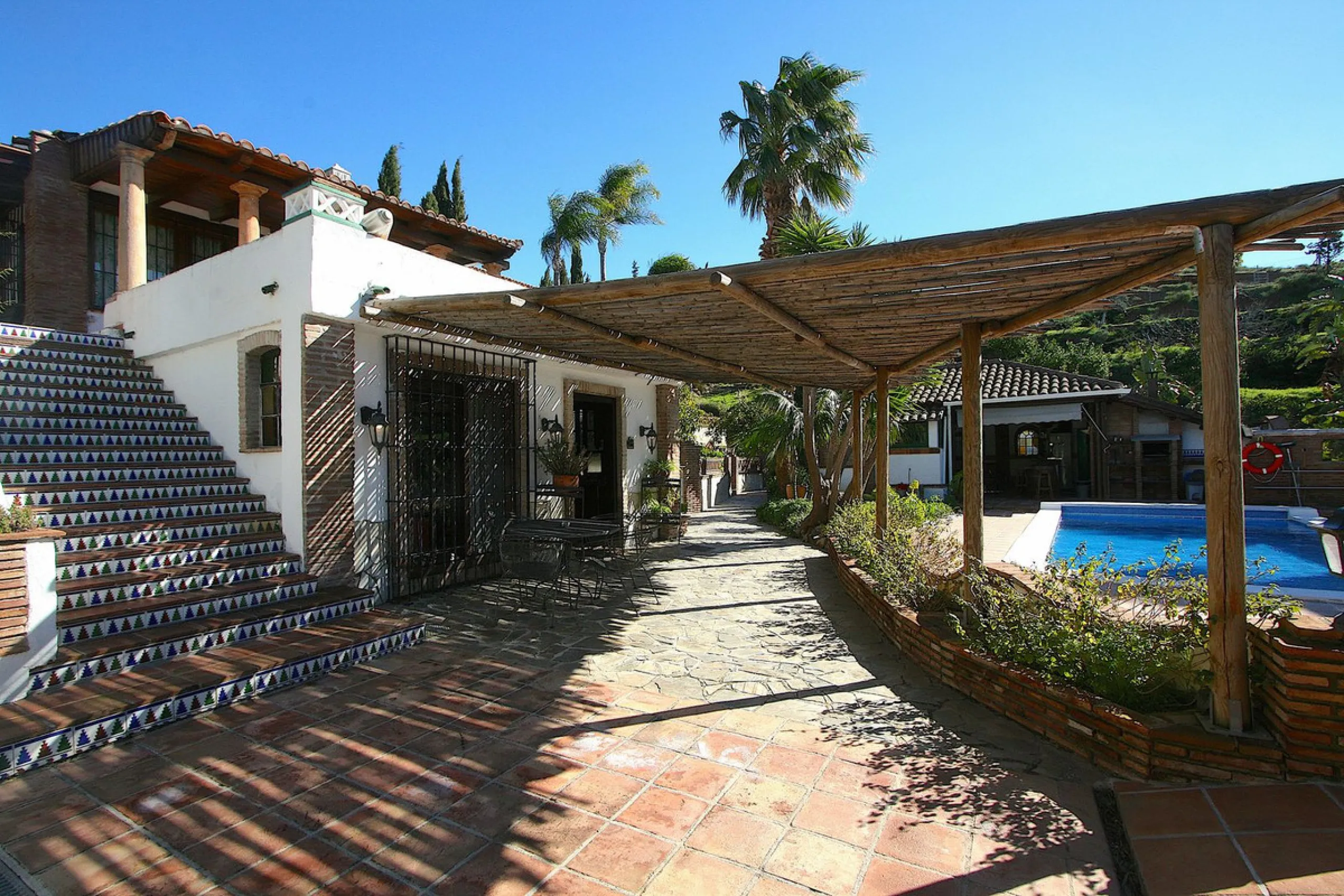 A rare opportunity to own a truly enchanting estate near the picturesque Mijas Pueblo. Set on an expansive 16,000 m² plot, this gated property offers breathtaking panoramic views surrounded by fruit trees, almond trees, and olive groves, creating a peacef