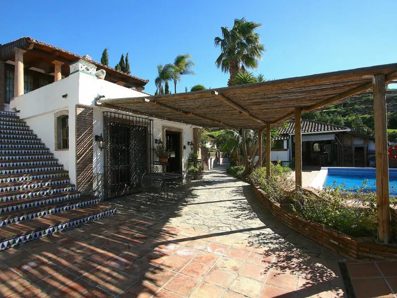 A rare opportunity to own a truly enchanting estate near the picturesque Mijas Pueblo. Set on an expansive 16,000 m² plot, this gated property offers breathtaking panoramic views surrounded by fruit trees, almond trees, and olive groves, creating a peacef