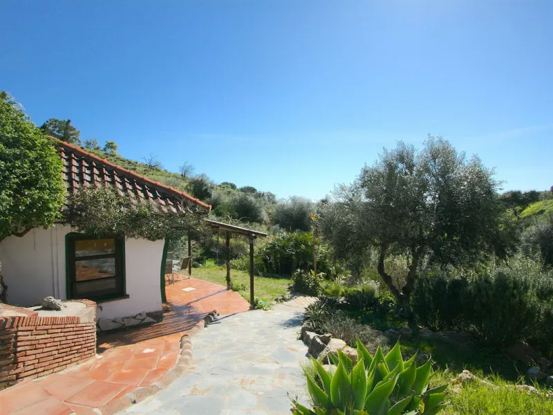 A rare opportunity to own a truly enchanting estate near the picturesque Mijas Pueblo. Set on an expansive 16,000 m² plot, this gated property offers breathtaking panoramic views surrounded by fruit trees, almond trees, and olive groves, creating a peacef