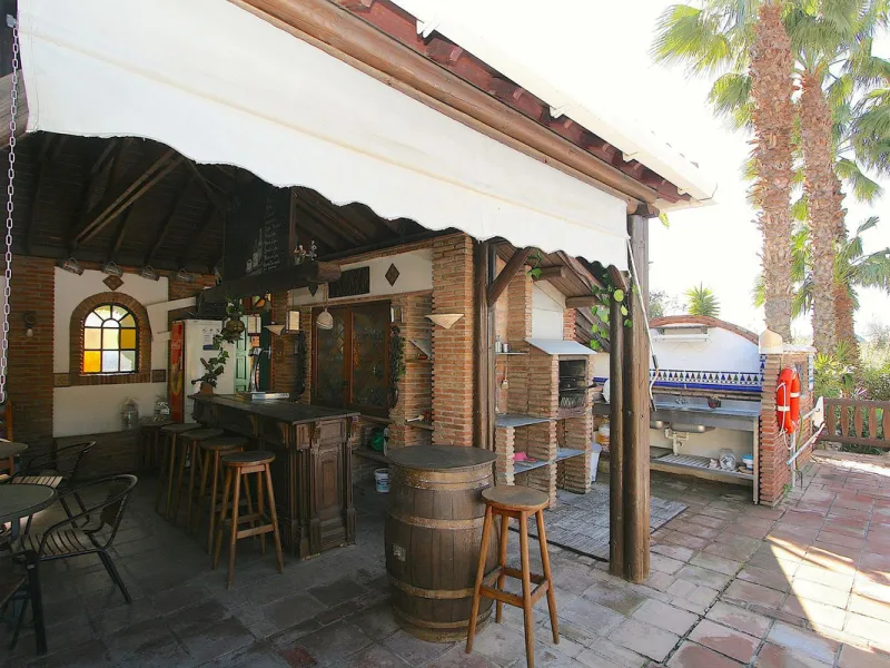 A rare opportunity to own a truly enchanting estate near the picturesque Mijas Pueblo. Set on an expansive 16,000 m² plot, this gated property offers breathtaking panoramic views surrounded by fruit trees, almond trees, and olive groves, creating a peacef