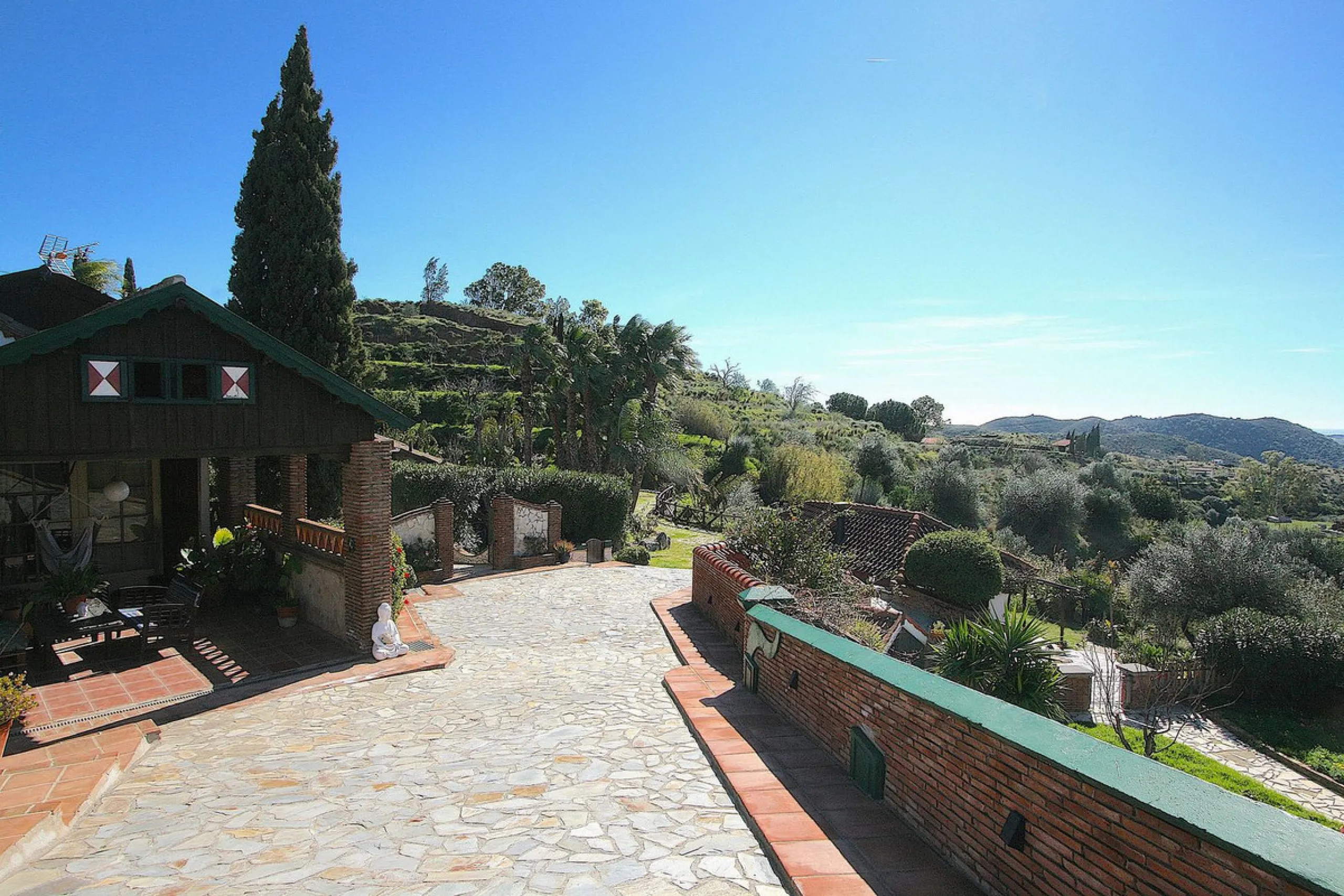 A rare opportunity to own a truly enchanting estate near the picturesque Mijas Pueblo. Set on an expansive 16,000 m² plot, this gated property offers breathtaking panoramic views surrounded by fruit trees, almond trees, and olive groves, creating a peacef