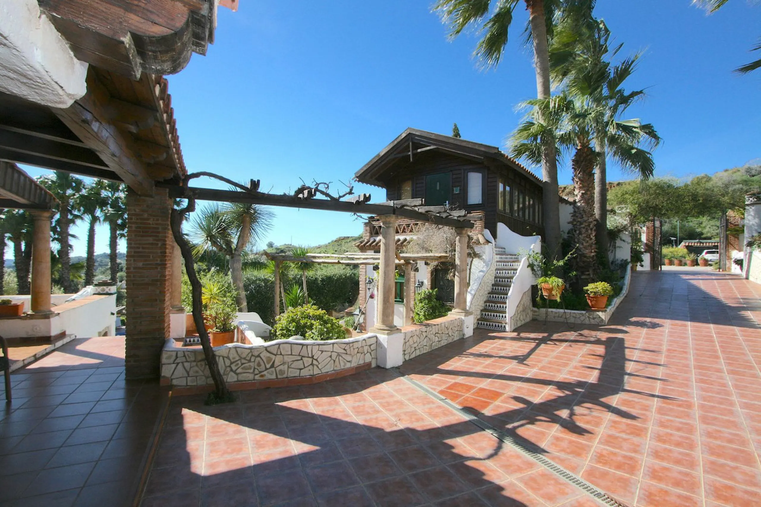 A rare opportunity to own a truly enchanting estate near the picturesque Mijas Pueblo. Set on an expansive 16,000 m² plot, this gated property offers breathtaking panoramic views surrounded by fruit trees, almond trees, and olive groves, creating a peacef