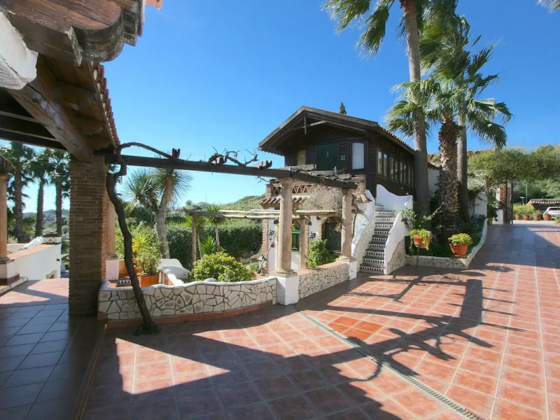 A rare opportunity to own a truly enchanting estate near the picturesque Mijas Pueblo. Set on an expansive 16,000 m² plot, this gated property offers breathtaking panoramic views surrounded by fruit trees, almond trees, and olive groves, creating a peacef