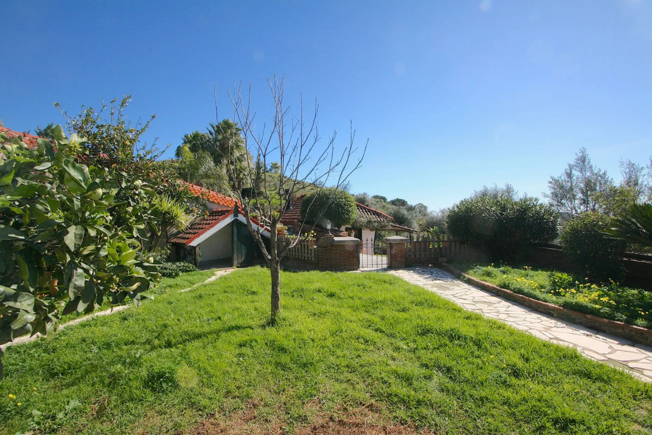 A rare opportunity to own a truly enchanting estate near the picturesque Mijas Pueblo. Set on an expansive 16,000 m² plot, this gated property offers breathtaking panoramic views surrounded by fruit trees, almond trees, and olive groves, creating a peacef